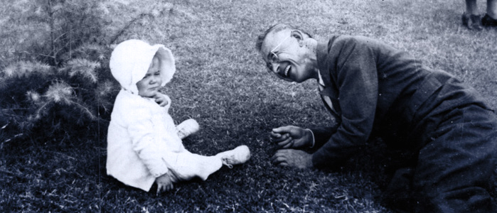 Victor-Houteff-smiling-at-child